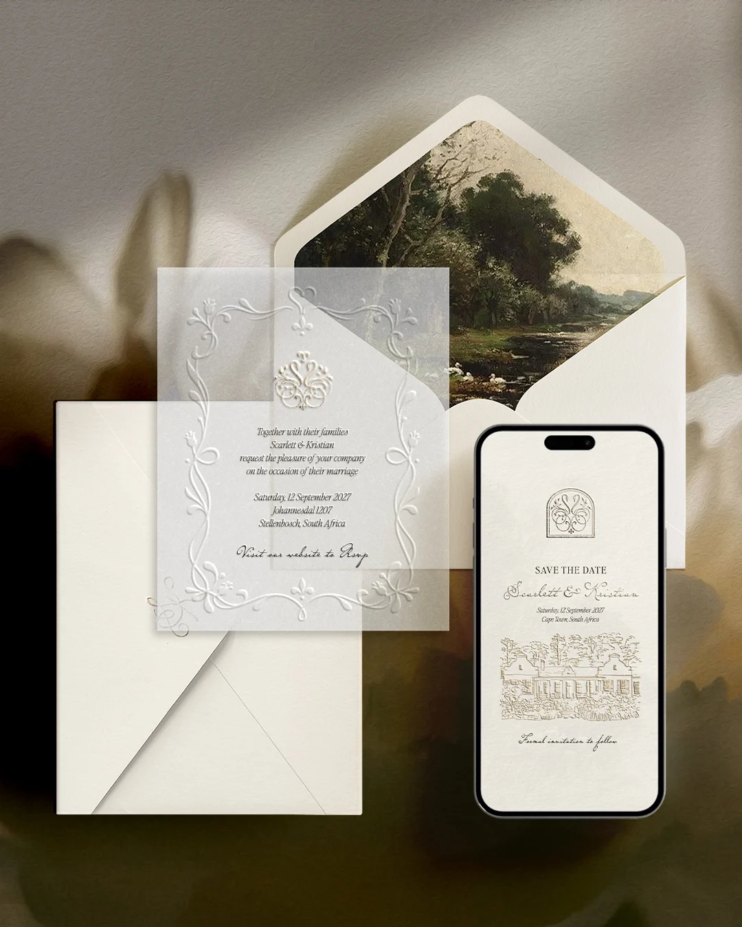 Ivory wedding invitation with vellum overlay beside a matching digital invitation on a phone