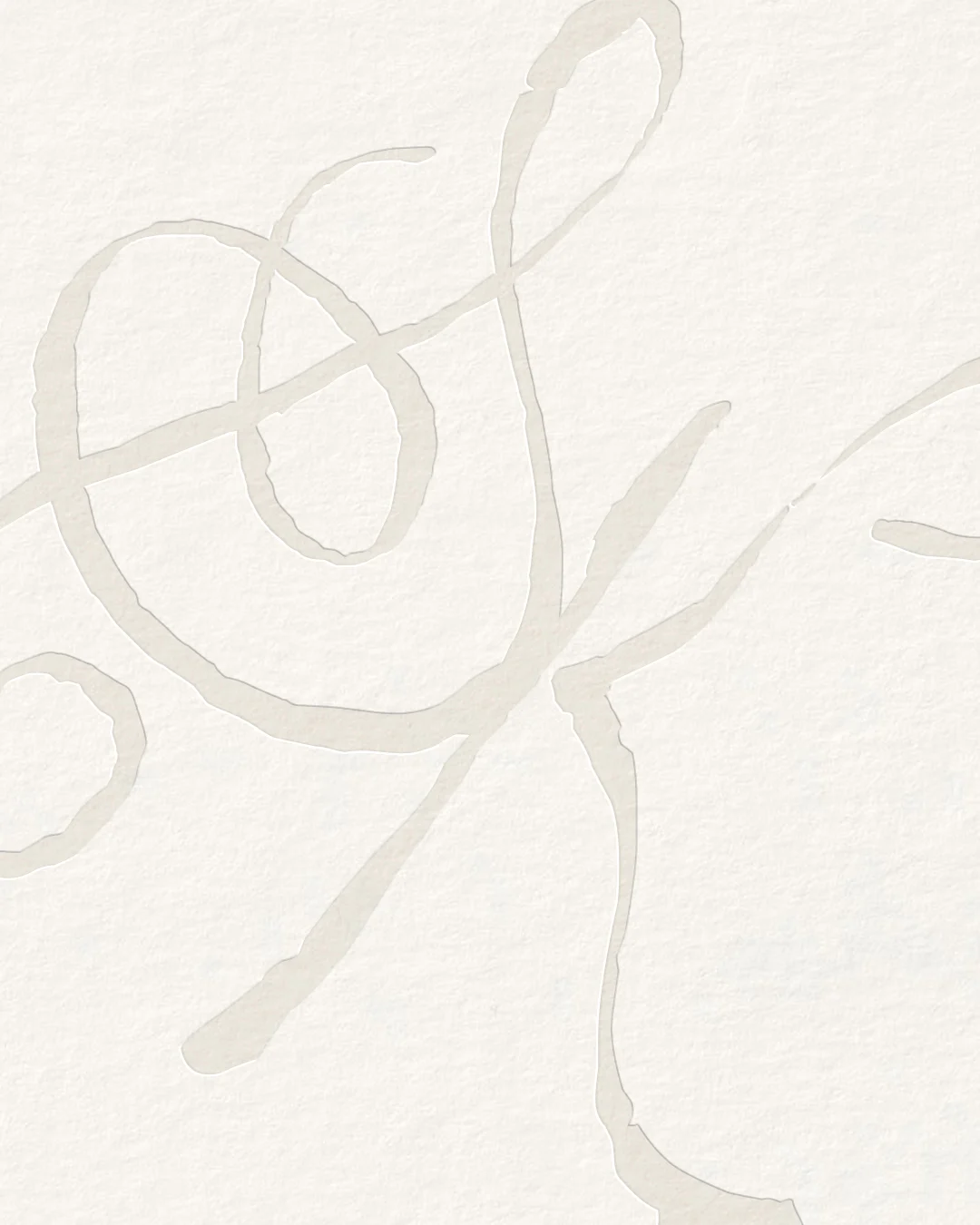 Ivory textured paper with a large hand-drawn calligraphy monogram in pale beige